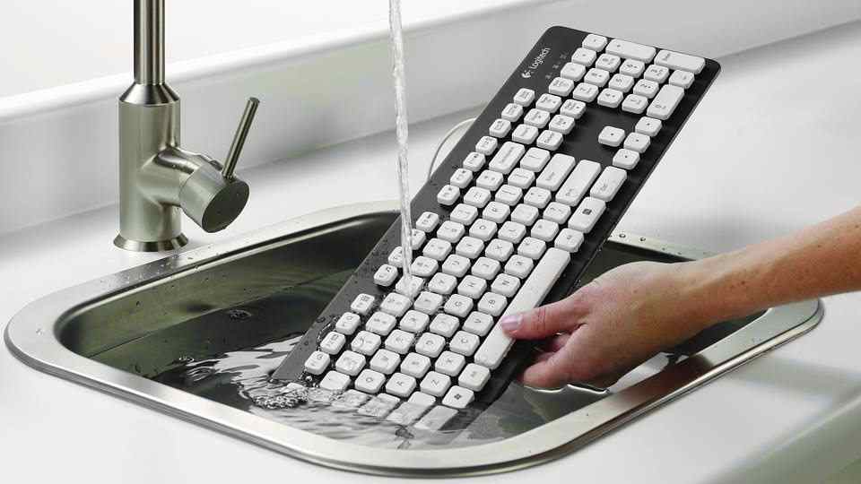 White Black Mechanical Keyboard Under Water in Sink