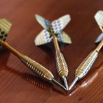 Darts Reflection on Wooden Table