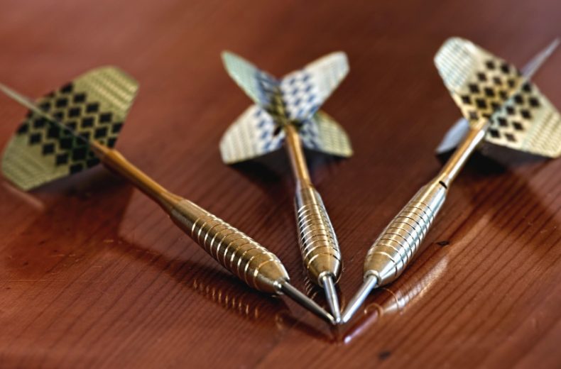 Darts Reflection on Wooden Table