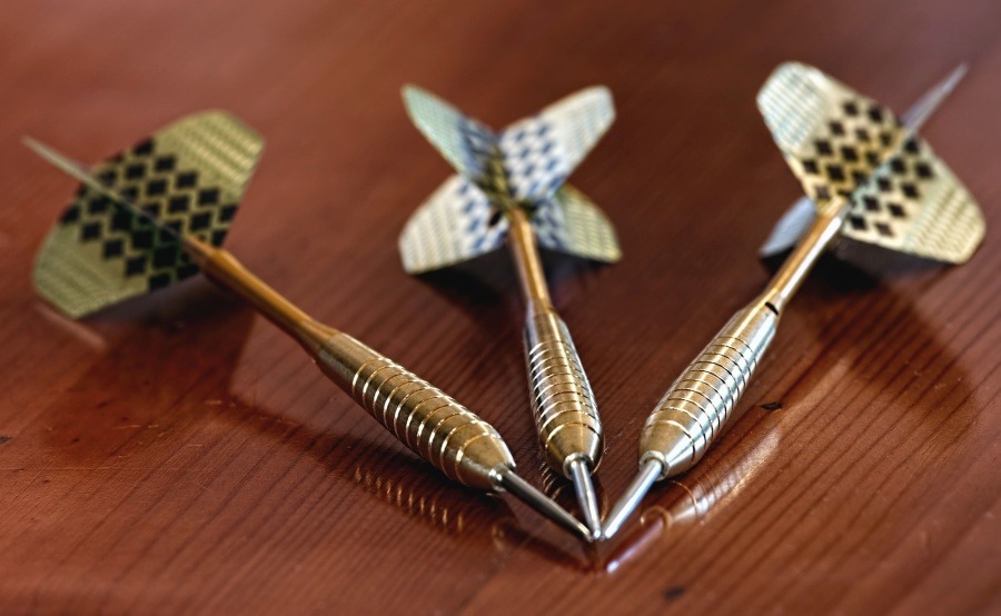 Darts Reflection on Wooden Table