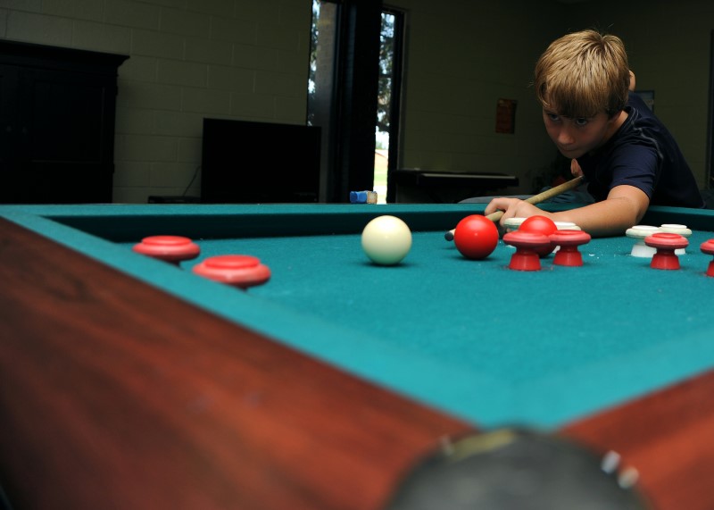 Kid Plays Bumper Pool Close Up