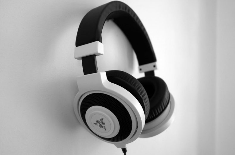 Black and White Razer Gaming Headset Hanging on Wall