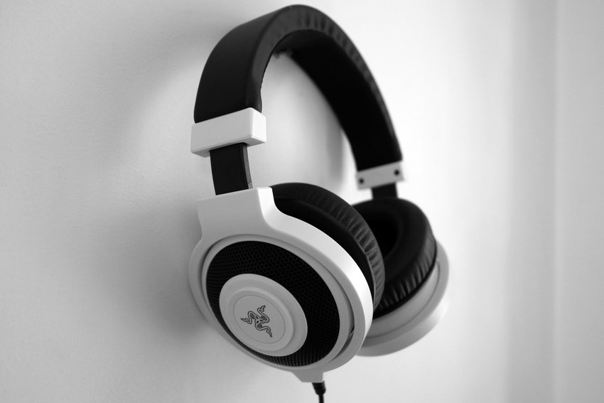 Black and White Razer Gaming Headset Hanging on Wall