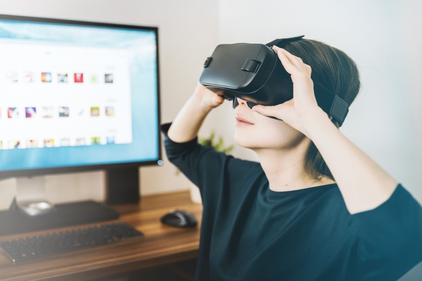 girl putting on vr headset