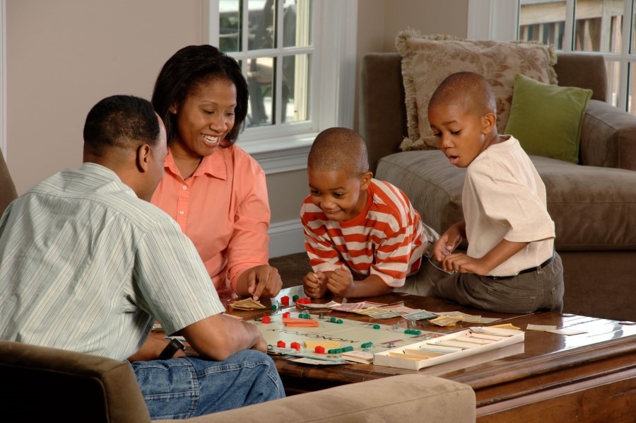 Happy Family playing board game